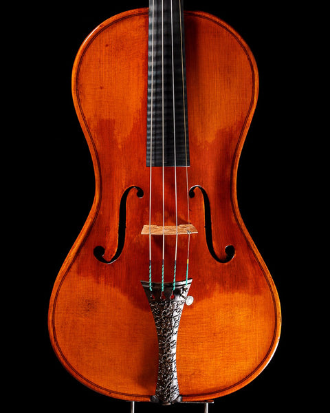 A cornerless violin with an antiqued oil finish