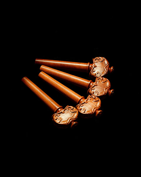 A set of four Alard violin pegs
