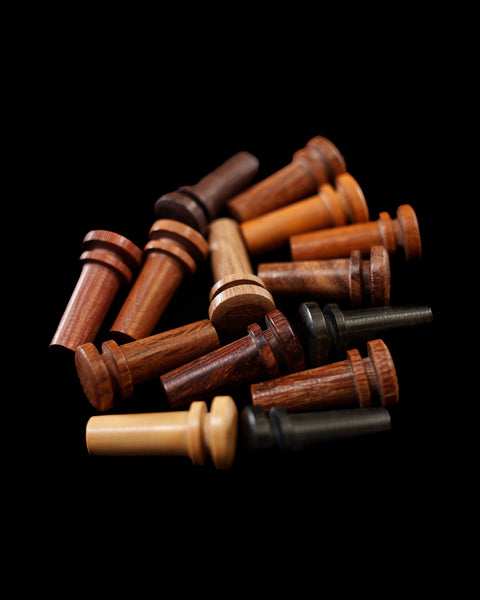 A variety of endpins for violin or viola in a range of different woods